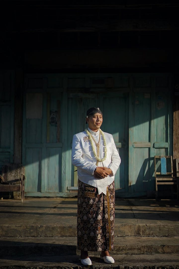 a man wearing traditional javanese wedding costume