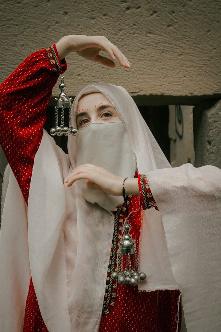portrait of woman in traditional clothing with niqab