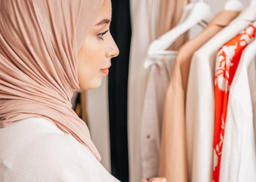 a woman in hijab looking clothes