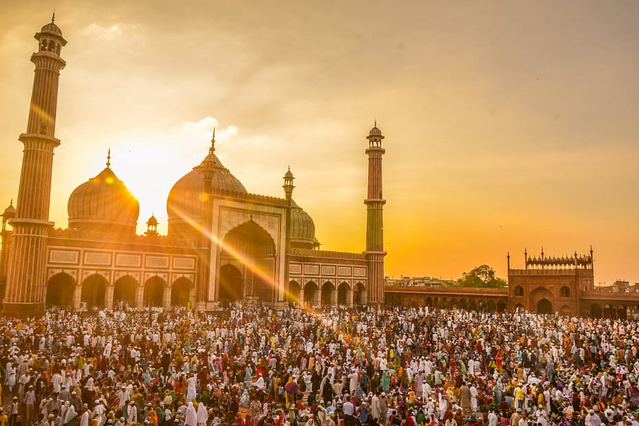 photo of people in front of mosque during golden hour