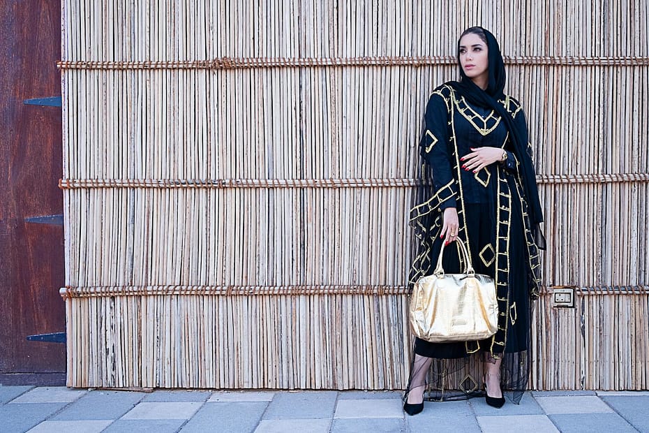 Woman in Blue and Beige Long-sleeved Dress Holding a Yellow Bag