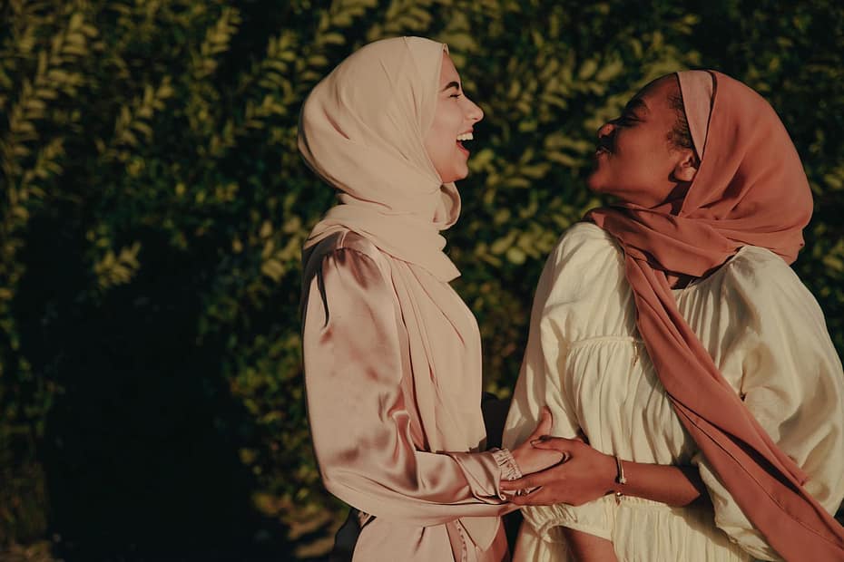 Side View of Two Women Wearing Hijabs