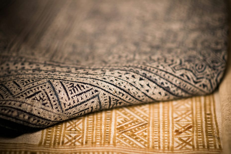 A close up that shows the texture of two different patterned rugs